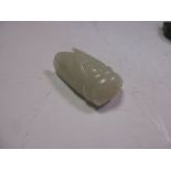 A nephrite jade cicada pendant carved from an evenly pale green stone, the suspension loop drilled