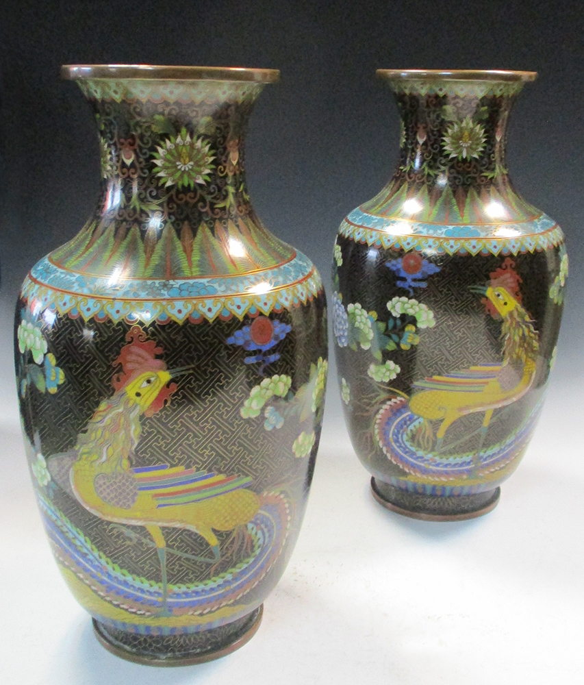 A pair of 20th century black ground cloisonne vases, the waisted necks enamelled with lotus, ruyi