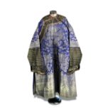 A late 19th/early 20th century blue dragon robe, machine woven in silver white thread with eight