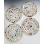 A set of three and another 18th century famille rose plate, the first painted with a mother and
