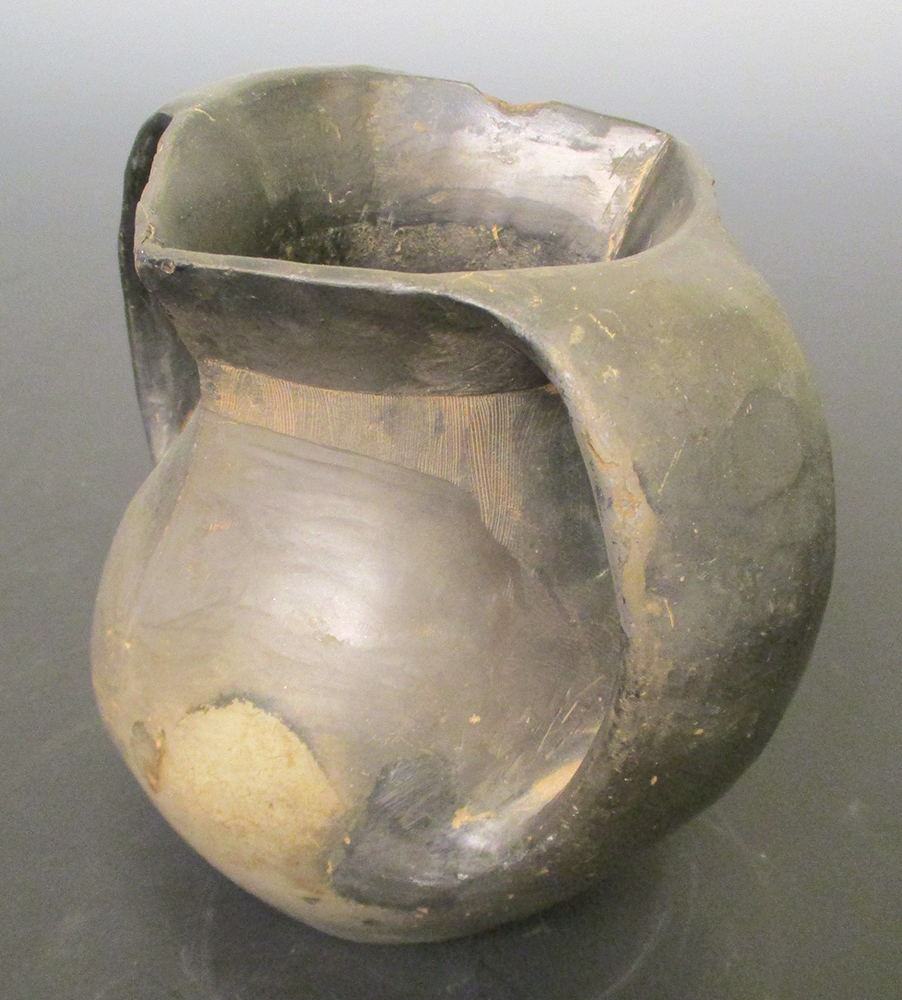 A Han dynasty grey pottery vase, the strap handles applied from the rim to the girth of the ovoid - Image 2 of 4