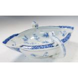 An 18th century blue and white double lipped sauce boat, the head terminals looking into the