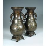 A pair of late 19th/early 20th century inlaid bronze vases, emblazonned pearls within copper