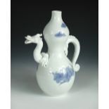 A Hirado blue and white double gourd shaped ewer painted on one side of the dragon handle and