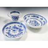 An 18th century blue and white cress drainer together with a two handled cup and saucer, the first