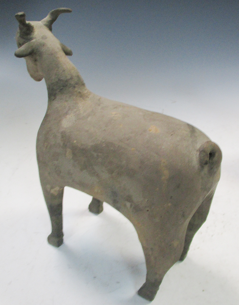A pair of Han dynasty grey pottery goats, each characterful figure standing four square, its eyes - Image 5 of 7