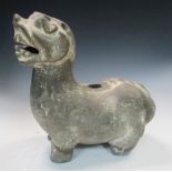 A Five Dynasties grey pottery figure of a lion, it stands on short legs with raised head and open