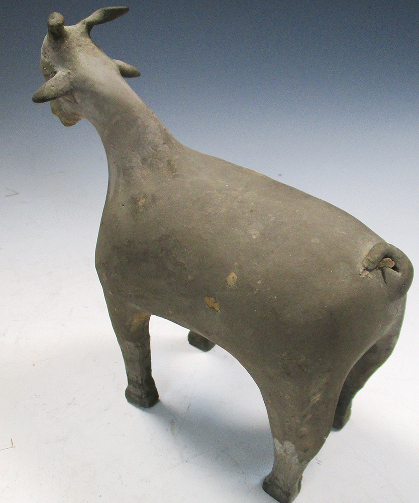 A pair of Han dynasty grey pottery goats, each characterful figure standing four square, its eyes - Image 3 of 7