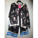 A black silk robe together with a pair of culottes, both embroidered with flowers and fruit, the