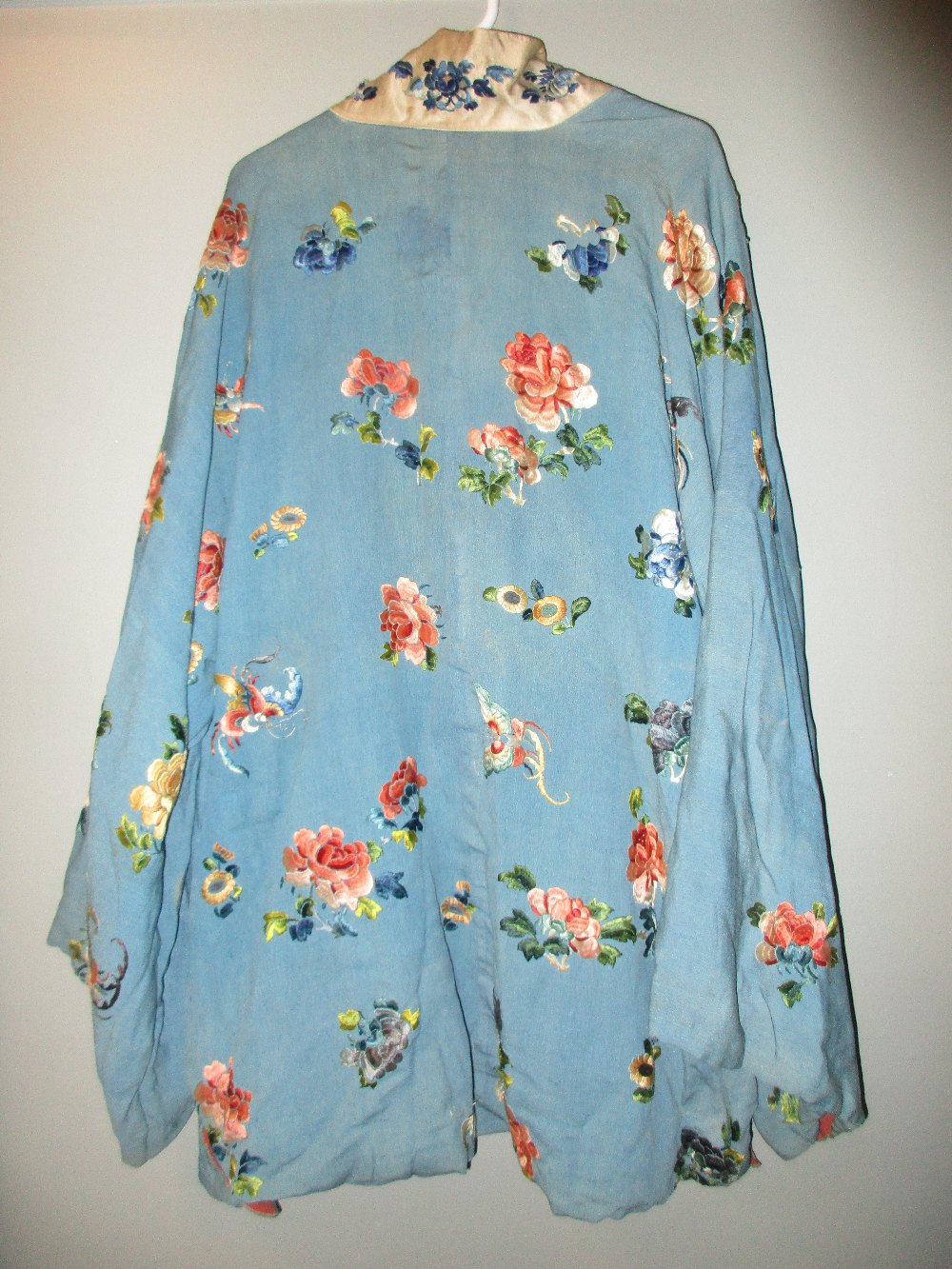 A late 19th/early 20th century turquoise silk jacket, embroidered with butterflies amongst scattered - Image 2 of 9