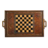 A walnut two handled reversible tray, inlaid with chess board and butterfly and baize lined verso to