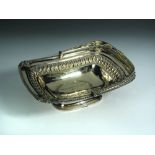 A George III silver gilt cake basket, by Samuel Hennell, London 1811, the plain rectangular bowl