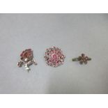 Three flat cut garnet brooches with Georgian origins, all the stones, of varying reds and pinks,