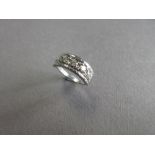 A five stone diamond ring, the five round brilliant cut diamonds claw set within square corner