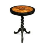 A Ceylonese ebony and specimen wood tripod table - early 19th century, on a twist carved column