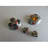 A small collection of Scottish 'pebble' jewellery, comprising two brooches and two stud buttons: the