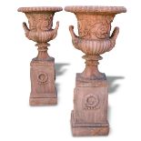 A pair of terracotta composite urns on stands - 20th century, of campana design (2) 308 x 62cm (