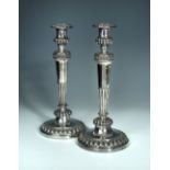 A pair of George III silver candlesticks, John Roberts & Co, Sheffield, 1807, the urnular sockets