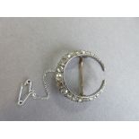An antique diamond closed crescent brooch, the near-complete hoop set with graduated rose cut