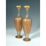 A pair of 19th century Continental overlay and gilt glass vases, the shouldered ovoid bodies
