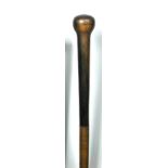 A late 19th or early 20th century Rhinoceros horn walking cane, of long tapering form with a bulbous