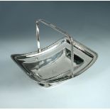 A George III silver cake basket, by Solomon Hougham, London 1807, of plain dished rectangular
