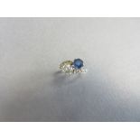 A diamond and sapphire two stone crossover 'thee and me' ring, the old brilliant cut round-oval