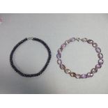 Two amethyst bead necklaces, the first of deep purple faceted bouton amethysts to an S-hook clasp,
