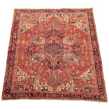 A Heriz carpet - late 19th century, 386 x 297cm (151 x 116in) Evidence of wear with some areas of