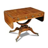 A Regency rosewood sofa table, with boxwood line inlaid decoration and corner anthemions, fitted two