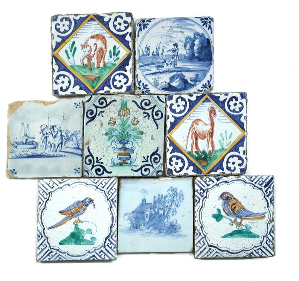 A pair of early maiolica Delft tiles, Middelburg 1520 - 1600, the centres decorated with an elephant