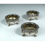 A set of three George IV silver salts, by William Eaton, London 1827, the circular bodies embossed