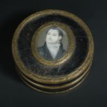 A French tortoiseshell and gilt metal mounted circular snuff box and cover, circa 1800, the top