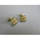 A pair of 18ct gold and enamel cufflinks by Boodle & Dunthorne, the square pierced faces designed as