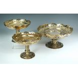 A Victorian composed silver gilt garniture of three comports, by Richard Martin & Ebenezer Hall, the