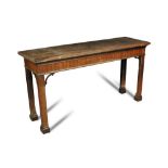 A small George III mahogany serving table, the rectangular top on square chamfered legs with fret