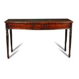 A Regency mahogany bow front serving table, with tablet moulded frieze, ribbed corner panels, on