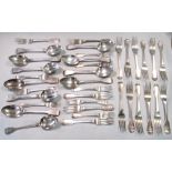 Eleven Victorian silver fiddle pattern table spoons, Seventeen table forks, and Five dessert