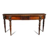 A Regency 'plum pudding' mahogany bow front serving table, with central drawer, brass lion mask