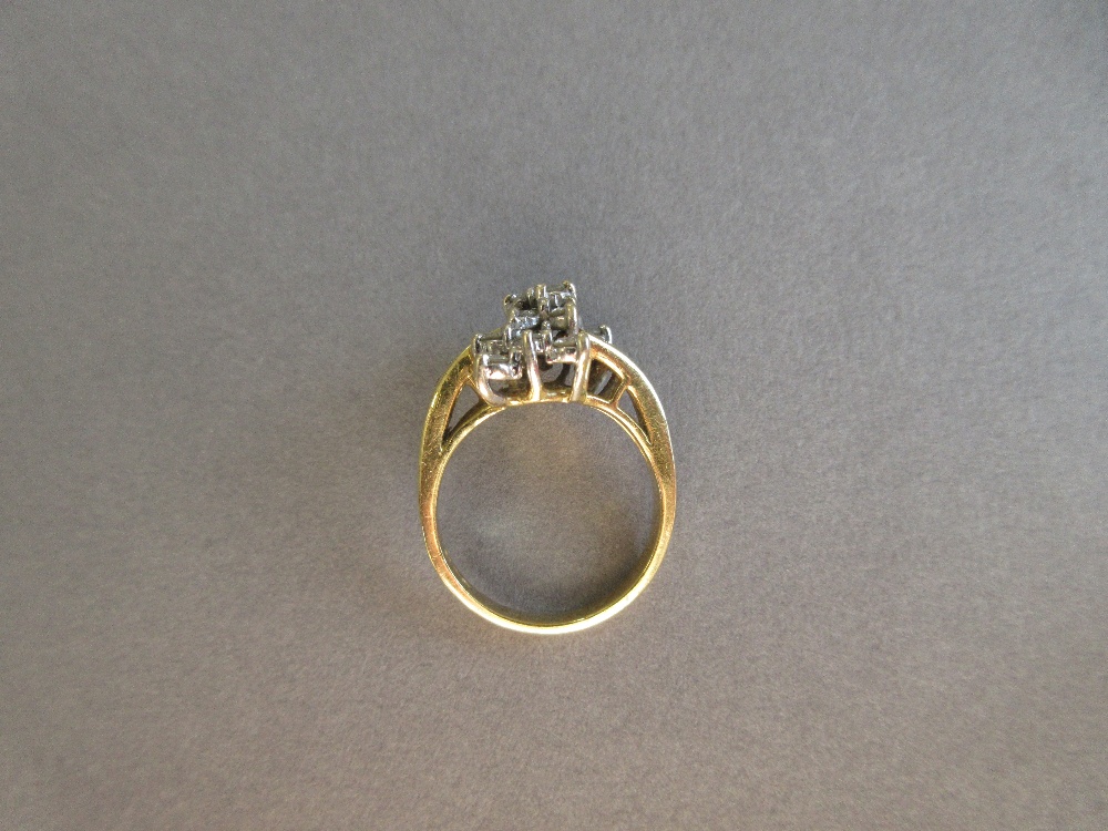 An asymmetrical diamond cluster ring, with a pierced bow form composed of tiered round brilliant cut - Image 3 of 5