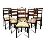 A set of ten Regency mahogany dining chairs, with ebonised detail decoration, rope twist bar backs