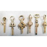 Six gilt metal watch keys, 19th century, various designs including one of ratchet type, largest 33mm