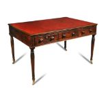 A Regency mahogany library table, with six frieze drawers, on turned palmette carved legs and