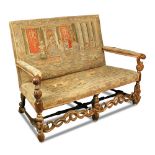A Carolean revival carved walnut framed settee - late 19th century, upholstered with tapestry