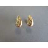 A pair of 18ct gold and diamond cufflinks by Paul Spurgeon, each designed as a textured teardrop