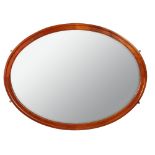 A large oval mahogany framed overmantle mirror - late 19th century, 123 x 164cm (48 x 64in) A