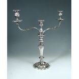 An old Sheffield plate three light, two branch candelabra, with scrolling acanthus cast arms and