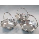 A set of three Edwardian silver sweetmeat baskets, by Walker & Hall, Sheffield 1909, each of