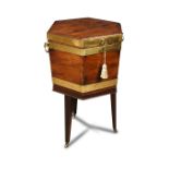 A George III hexagonal mahogany and brass bound wine cooler, with side carrying handles, a lined
