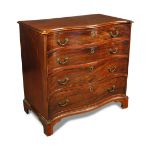 A George III mahogany serpentine chest, of four long drawers, with cast brass handles and